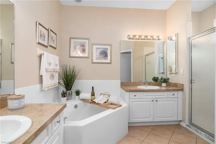 Dual sinks, shower, separate soaking tub and private toilet.