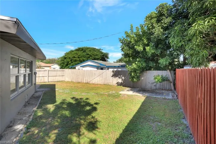 View of fenced backyard