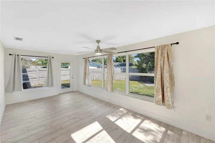 Spare room featuring ceiling fan and wood finished floors