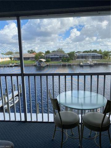 Primary suite has a slider out to the screened balcony and a great view of the Rubicon canal.