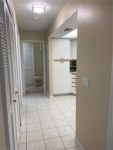 Looking in to the kitchen from the entry. Laundry/closet is on the left.