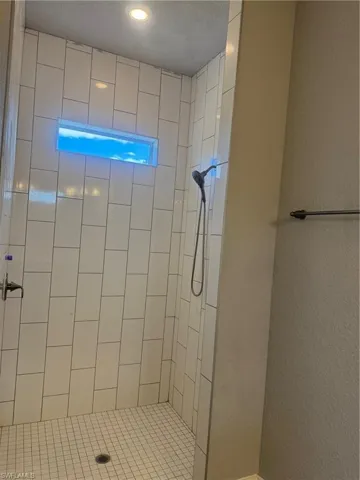 Bathroom with tiled shower