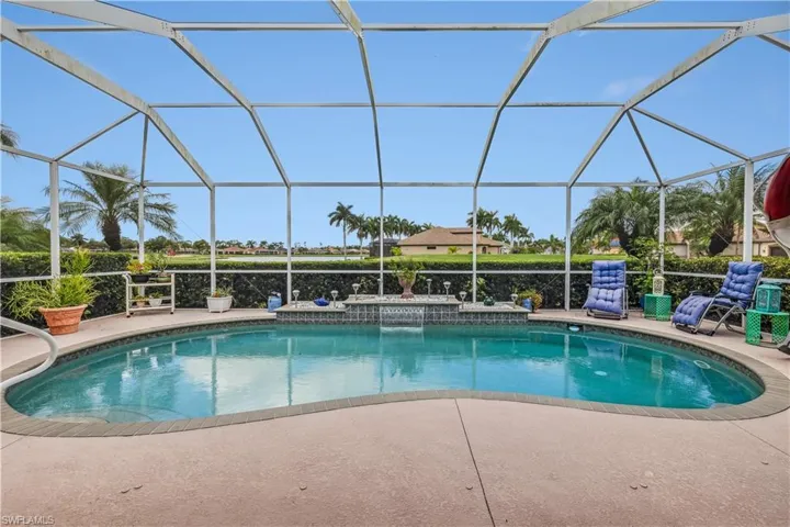 View of swimming pool with a patio area and a lanai