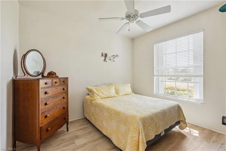 Bedroom with light wood-type flooring and ceiling fan
