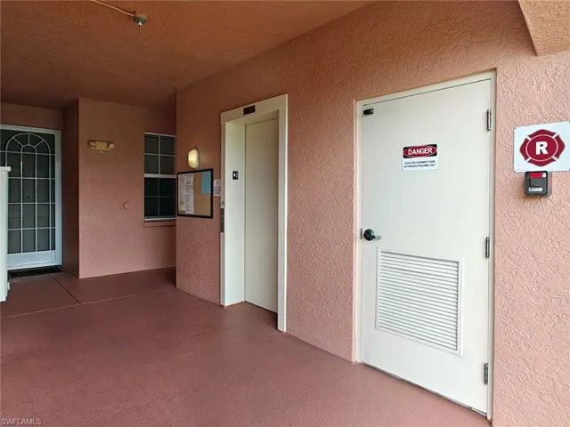 Elevator and stucco siding