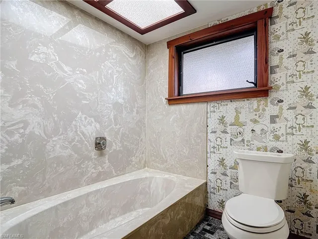 Tiled Guest bedroom 3 featuring ceiling fan