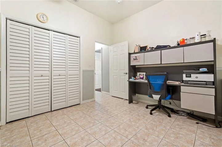 Office featuring baseboards and light tile patterned flooring