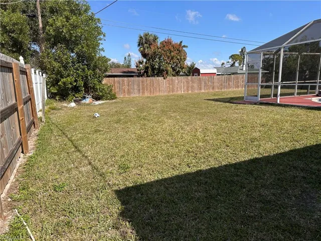 View of yard featuring a lanai
