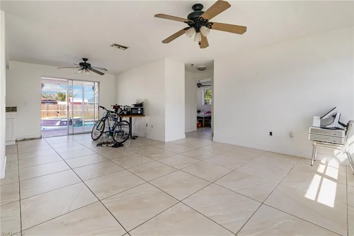 Unfurnished room with visible vents, baseboards, and light tile patterned floors