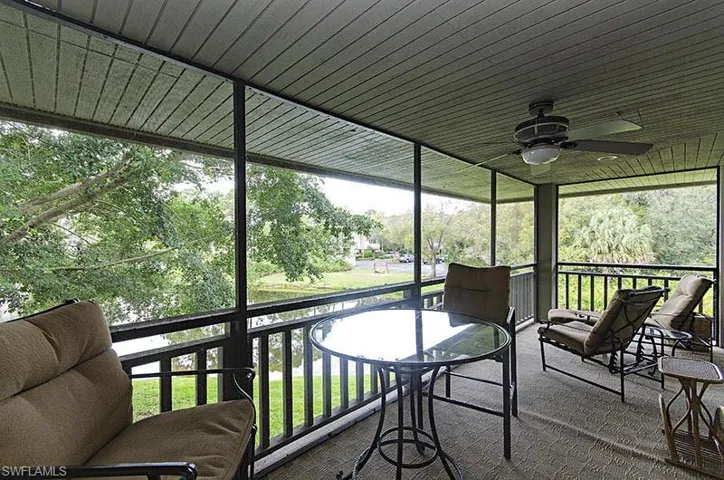 Sunroom with a ceiling fan