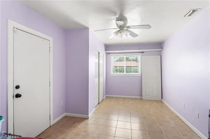 Carport converted to bedroom with separate entrance.  Perfect for a mudroom, guests or rental.