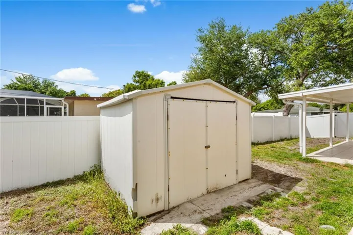 View of shed featuring a fenced backyard