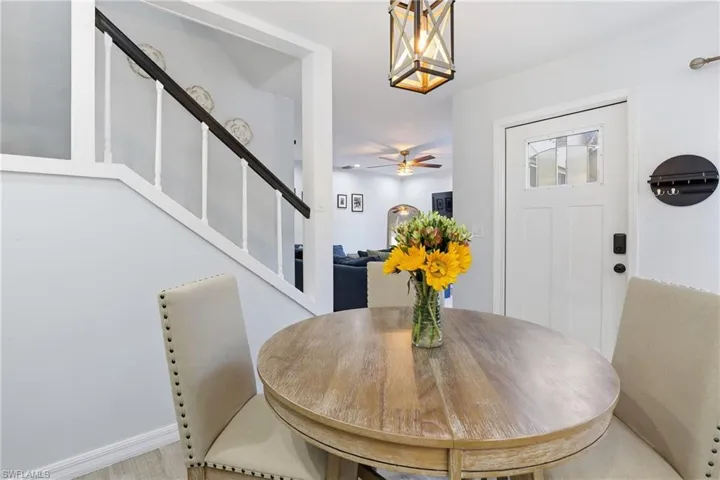 Dining room featuring stairs and a ceiling fan