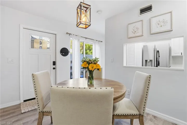 Dining area featuring baseboards and light wood-type flooring