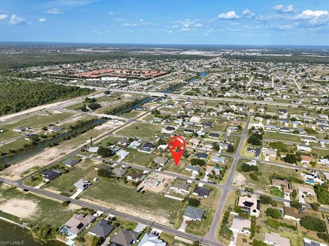 Aerial overview of property's location featuring nearby suburban area