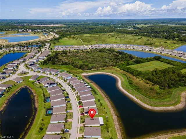 Aerial perspective showcasing a residential community with numerous homes