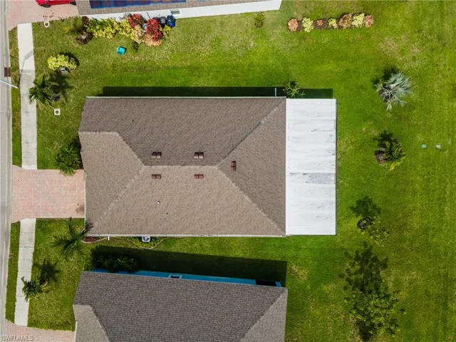 Pitched shingle roof with multiple roof vents