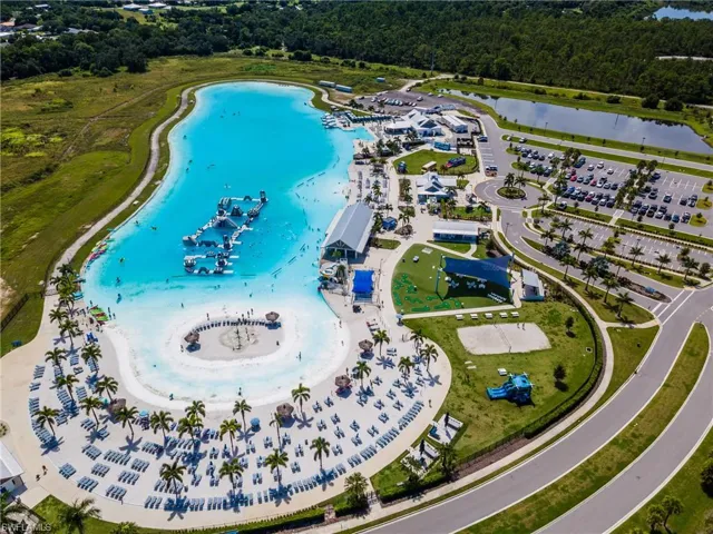 Expansive crystal-clear lagoon with sandy beach entry