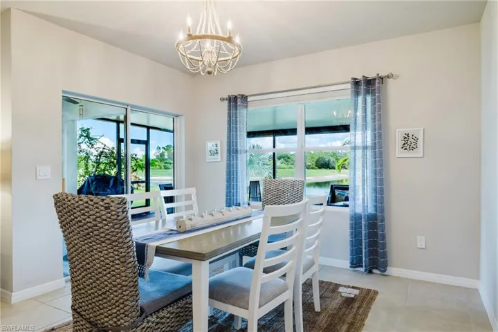 Recessed ceiling, neutral wall tones, large window, sliding glass door, and tile flooring