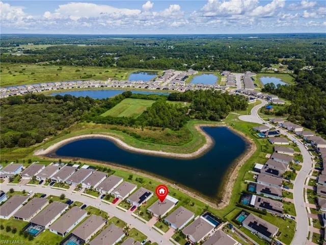Residential community featuring multiple water bodies and surrounding green spaces