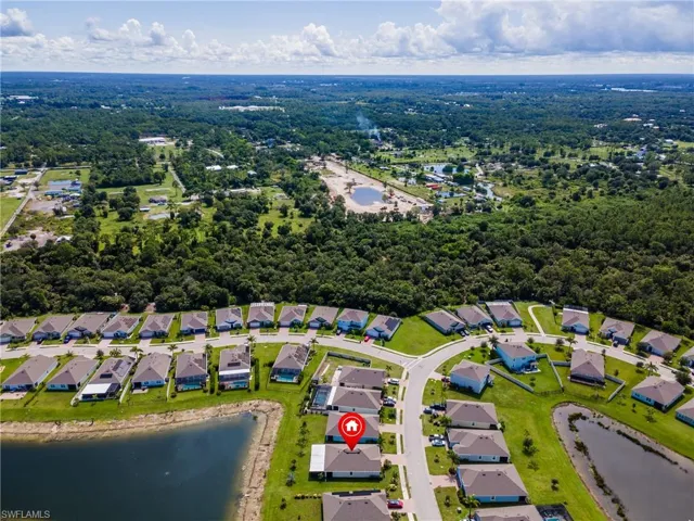 Aerial perspective of a developed residential community with multiple single-story homes