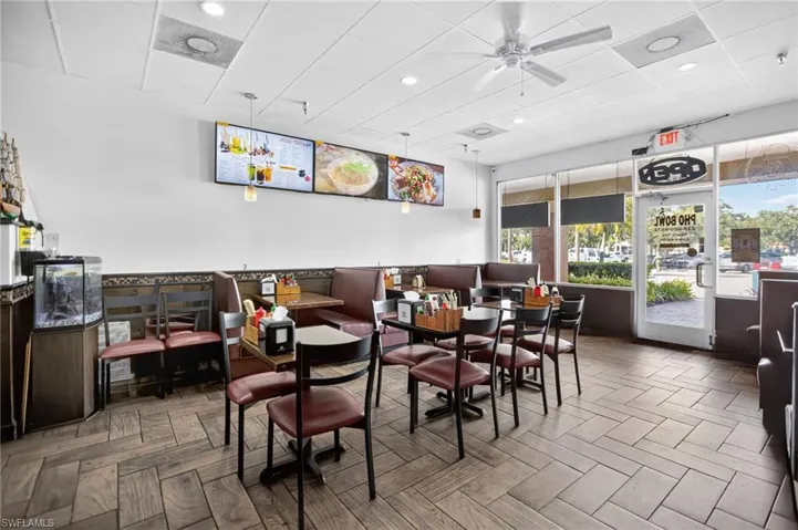 Dining space with a drop ceiling, a ceiling fan, and recessed lighting