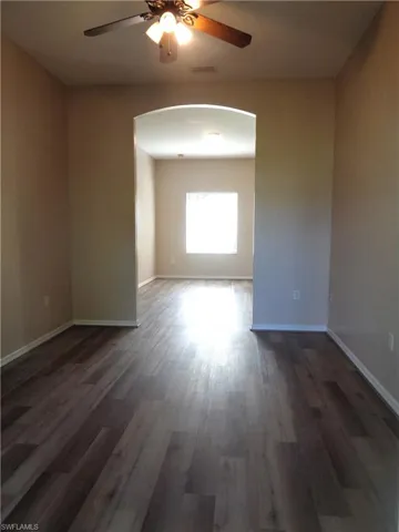 View of formal dining room with wood-like flooring accessing the Living Room