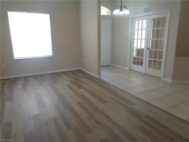 View of the Living Room and Den, featuring wood-style flooring and tile