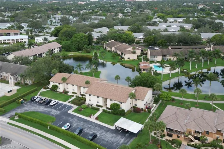 Aerial perspective of suburban area with a large body of water