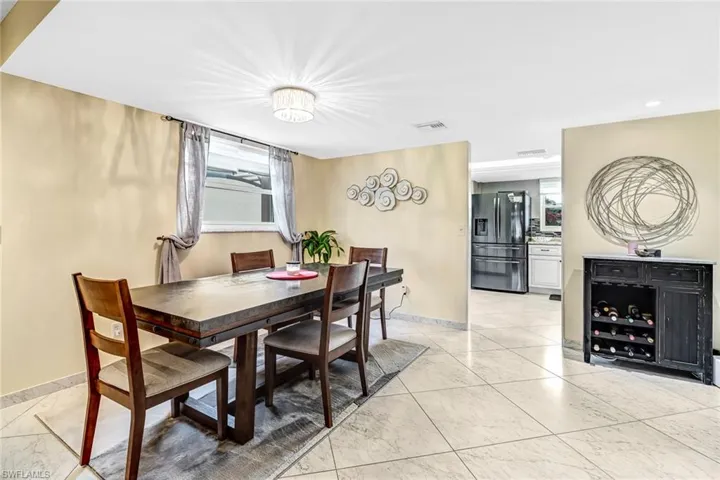 Dining room featuring light marble finish flooring