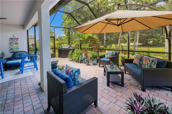 escape to your tropical oasis, extended, screened and pavered lanai