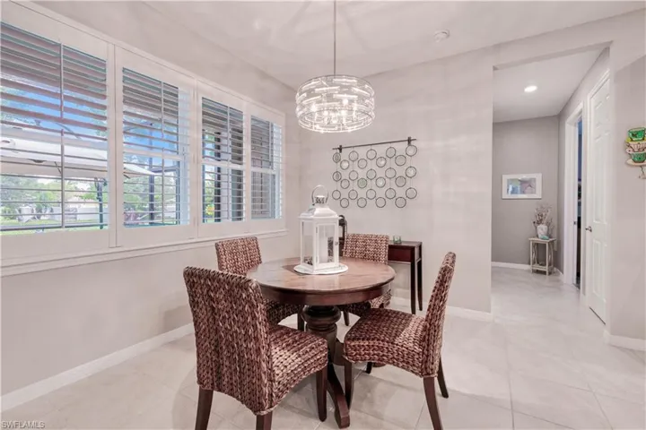 quaint dining nook overlooking lanai with tropical views