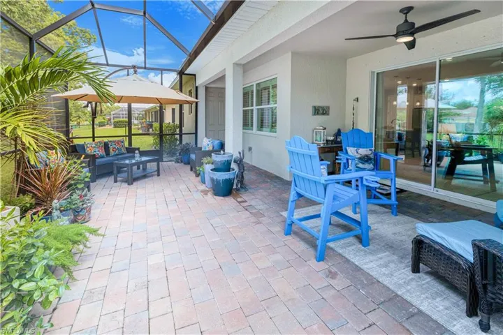 terrific screened-pavered lanai with tropical views and bathroom access