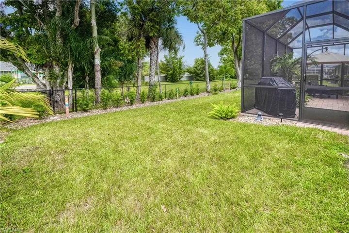 Spacious and beautifully landscaped fenced backyard