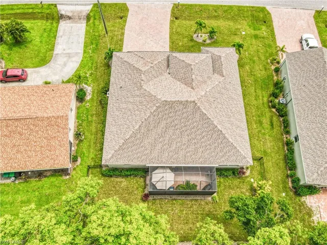 Aerial view of this terrific property surrounded by tropical landscaping