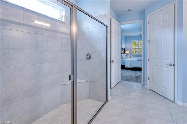 primary ensuite with walk-in tiled shower