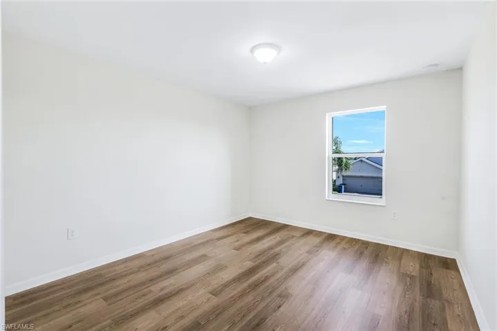 Empty room featuring hardwood / wood-style floors