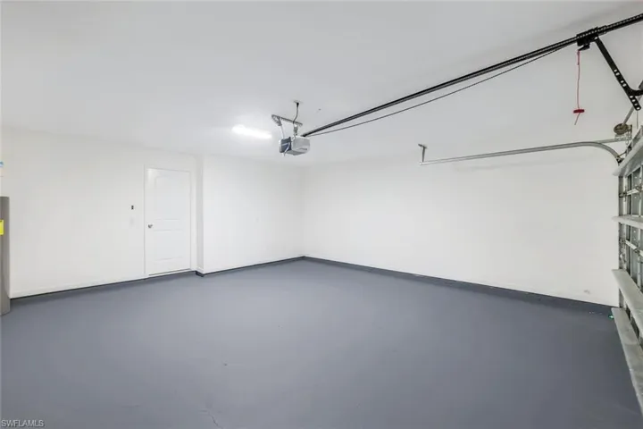 Garage featuring a garage door opener