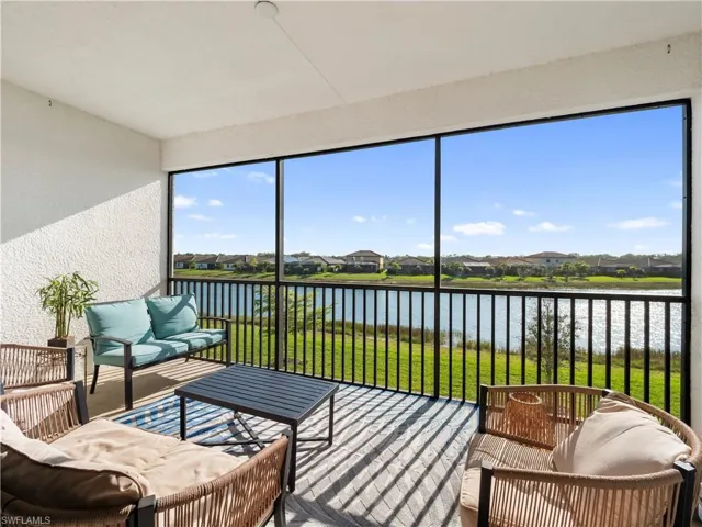 Sunroom / solarium featuring an outdoor hangout area, a residential view, a water view, and a balcony