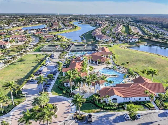 Aerial overview of property's location featuring a large body of water and nearby suburban area