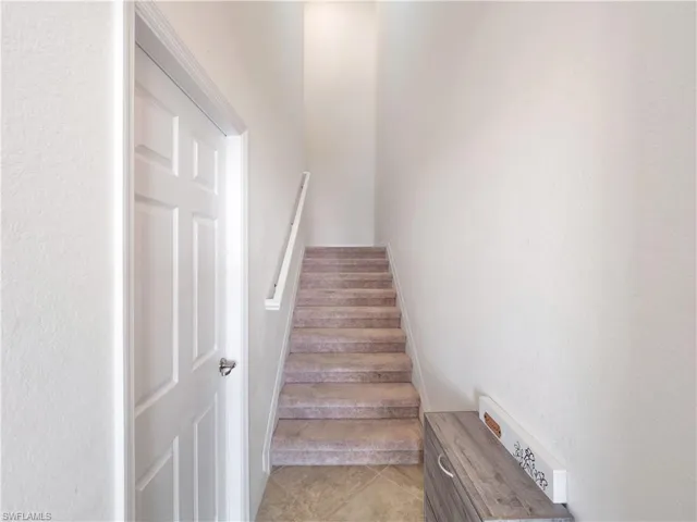 Stairway featuring tile patterned flooring