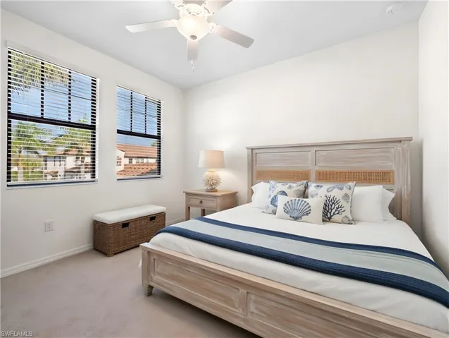 Bedroom featuring ceiling fan and light colored carpet