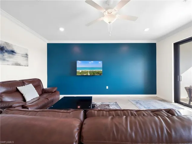 Tiled living room with crown molding, a ceiling fan, and recessed lighting