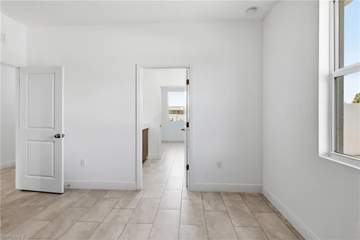 Unfurnished room featuring baseboards