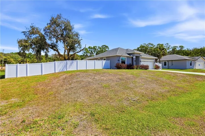 View of yard with an attached garage