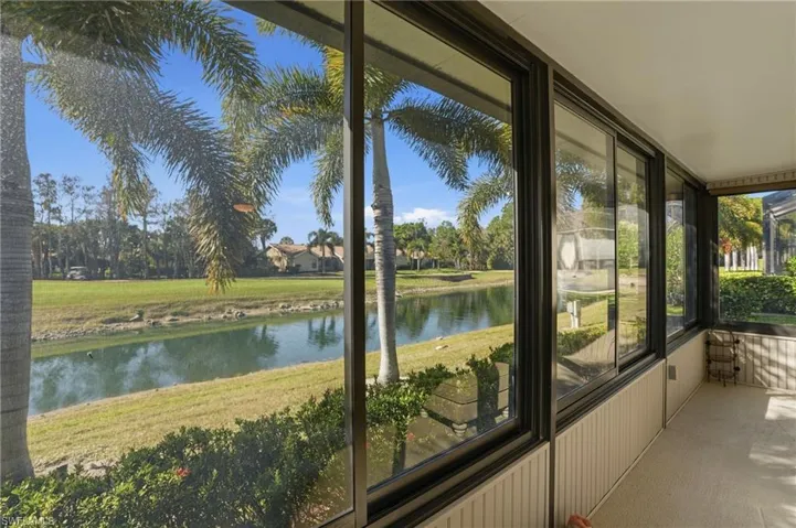 Unfurnished sunroom with a water view