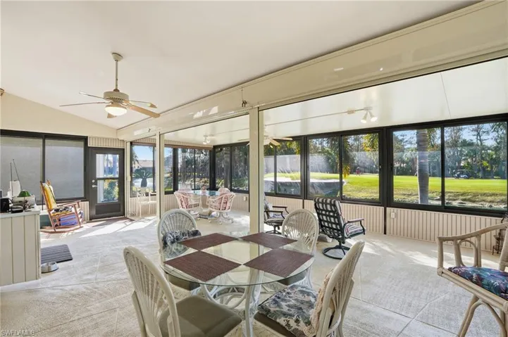 Sunroom / solarium with carpet and lofted ceiling