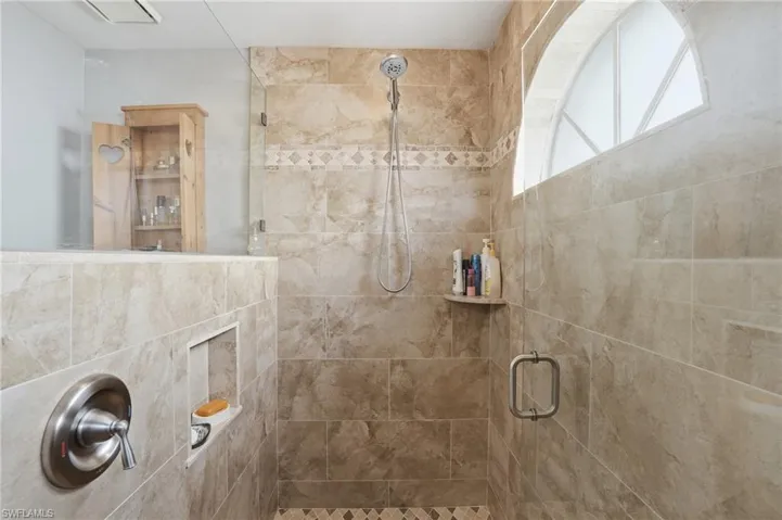 Full bathroom featuring a stall shower