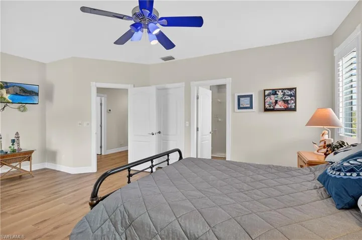 Bedroom featuring light wood-style floors and a ceiling fan
