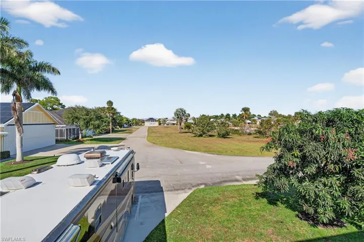 View of asphalt road with a residential view